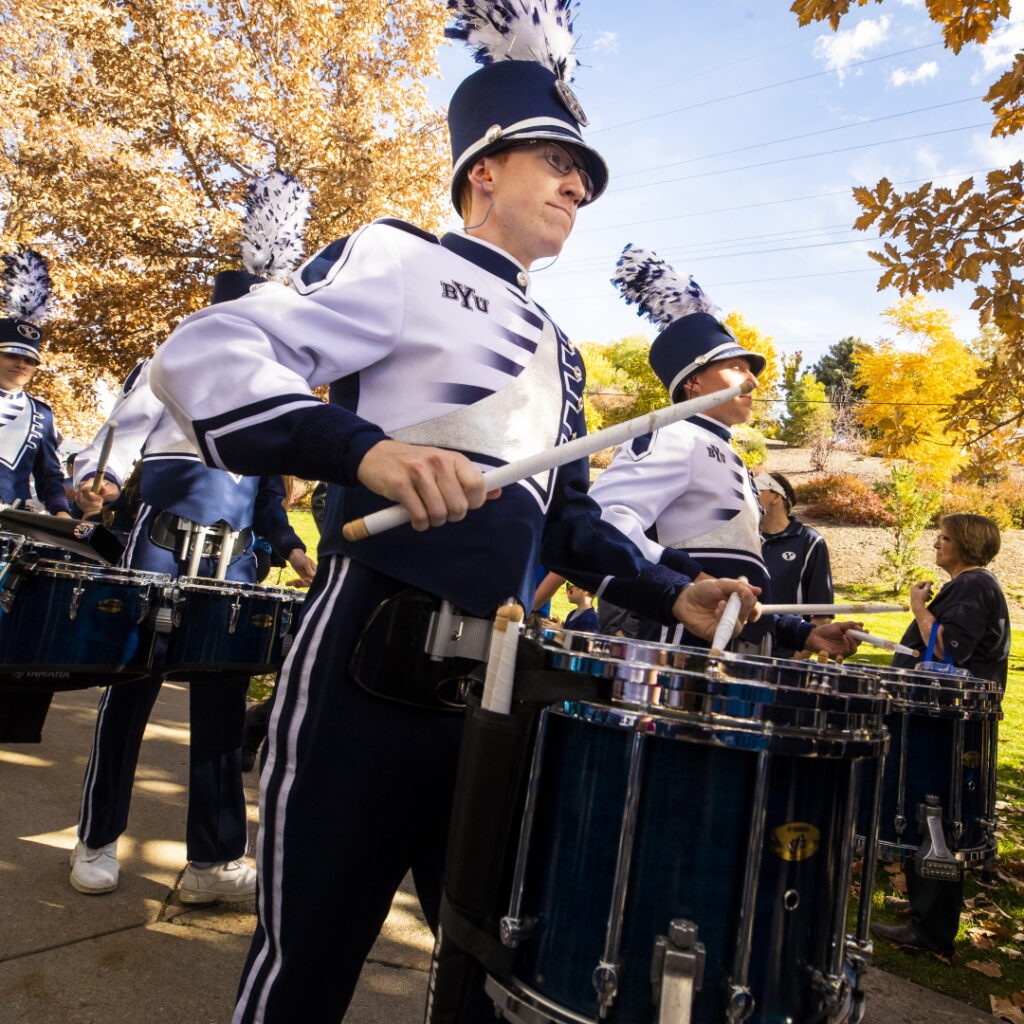 snare drum player marching in a parade